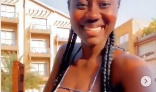 Hajia Bintu flaunts her raw chest in hot swimwear as she goes swimming